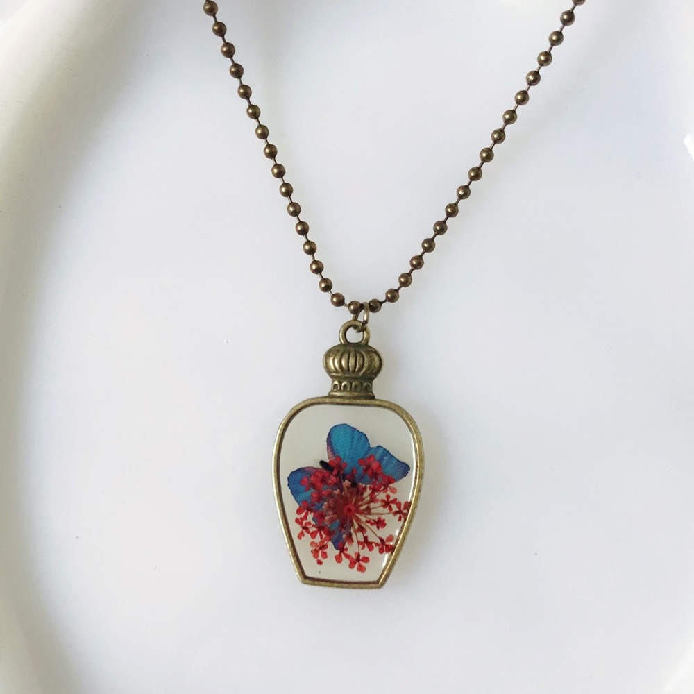 🔥4/$20 Vintage bottle pendant with butterfly
